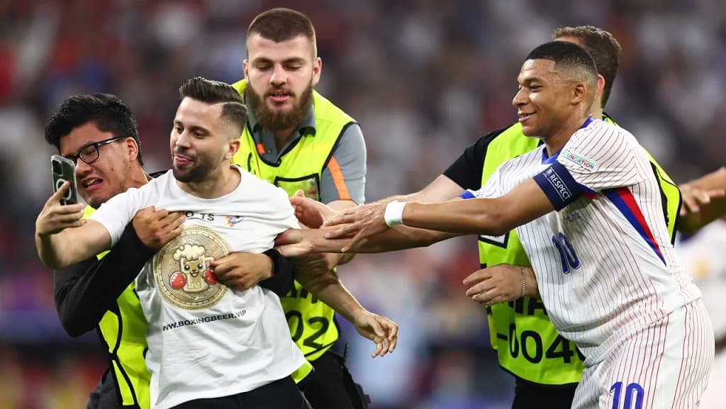 A pitch invasion happens when fans illegally enter the field, disrupting play or causing safety concerns.