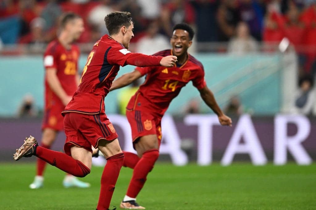 Spain's midfielder #09 Gavi celebrates with teammates after scoring his team's fifth goal during the Qatar 2022 World Cup Group E football match