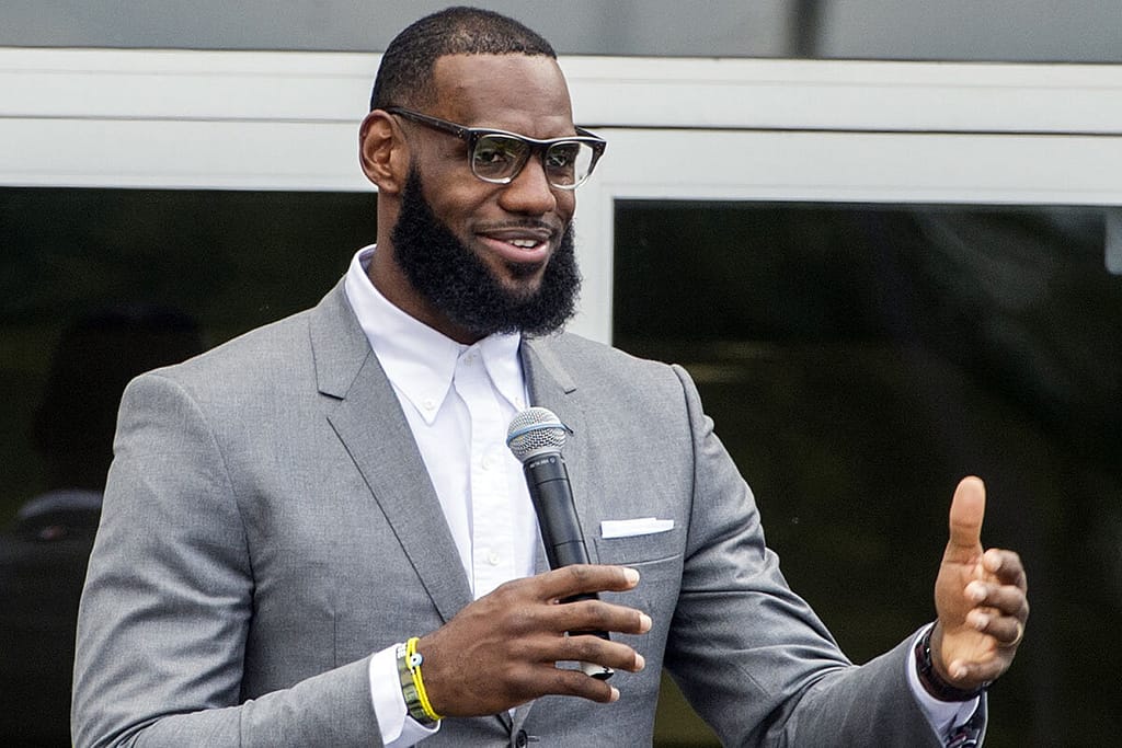 LeBron James promoting education through charitable work.