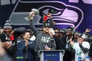 Sam Darnold raises the Lombardi Trophy during the Seahawks Super Bowl LX victory celebration.