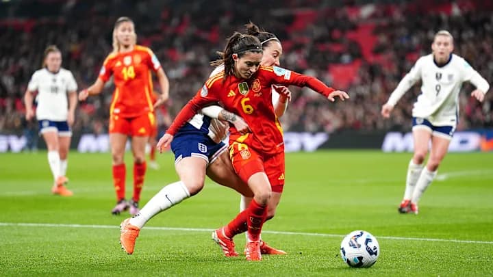 Female football players celebrating a goal, symbolizing the rise and impact of women’s football in 2025.
